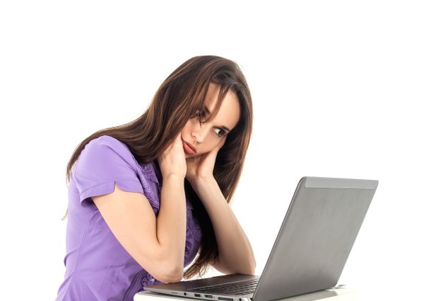 woman on laptop having wireless network problems image