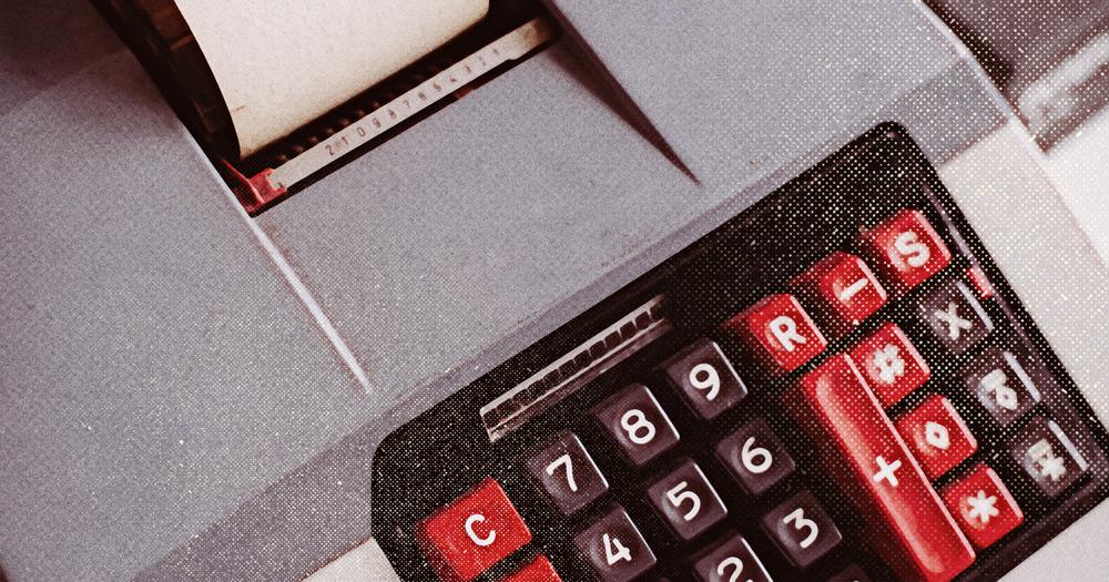 Old timey 10-key adding machine with a paper output